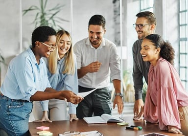 people discussing work around a table