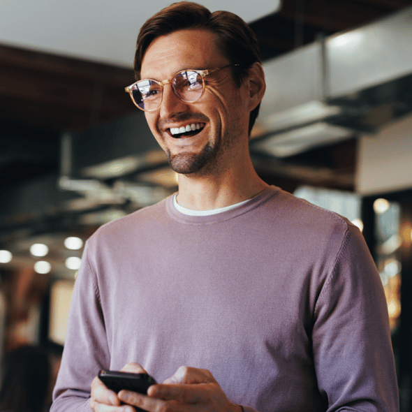 Cheerful Man in Purple Jumper